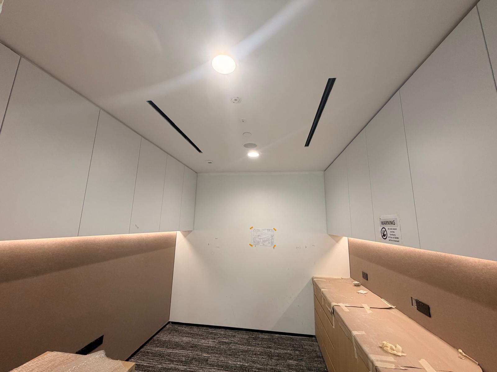 Acoustic focus booth with recessed lighting, speaker, smoke detector and power sockets installed in a Singapore office