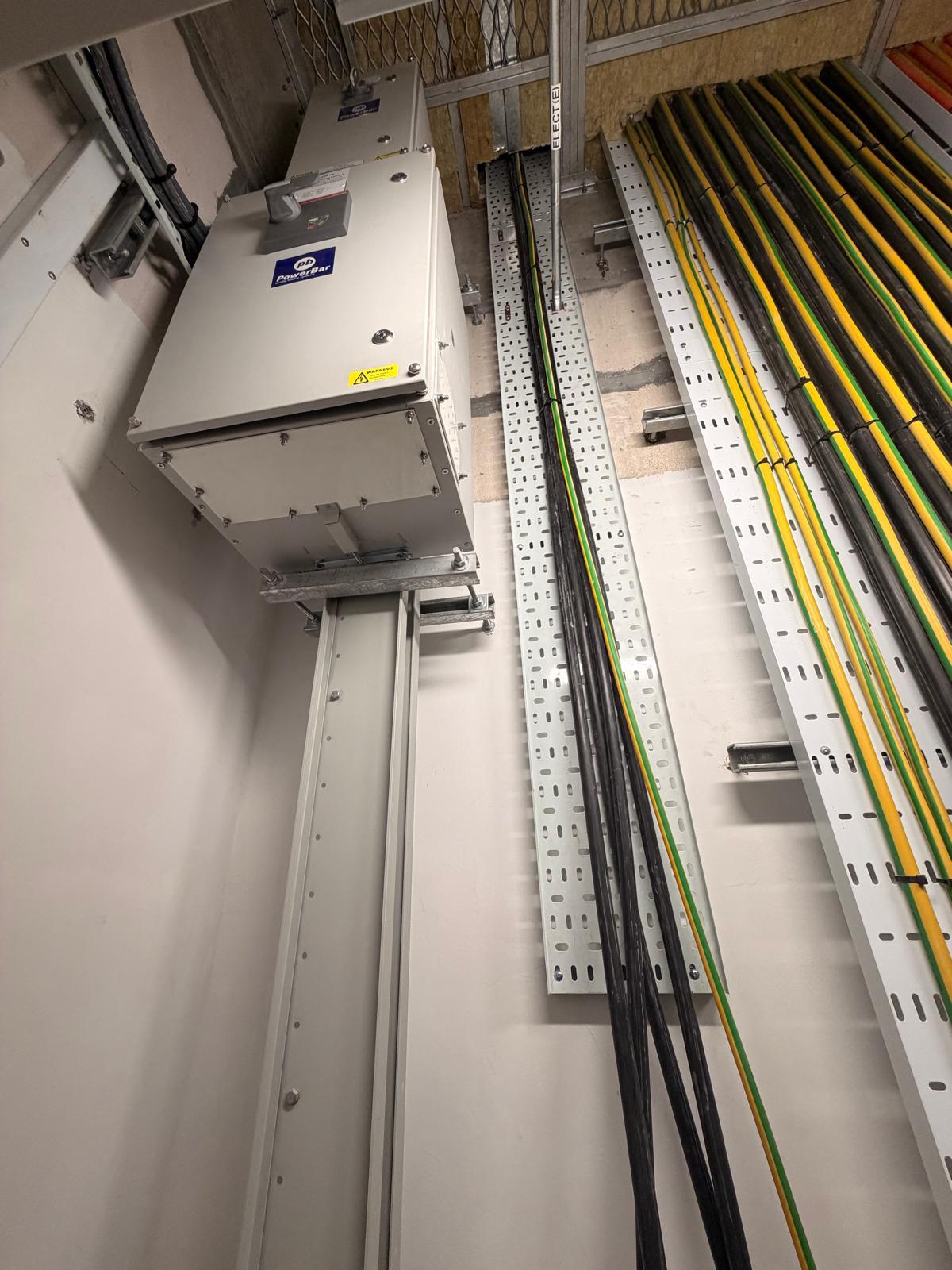 PowerBar busduct with tap-off box and cable containment installation in a Singapore commercial building