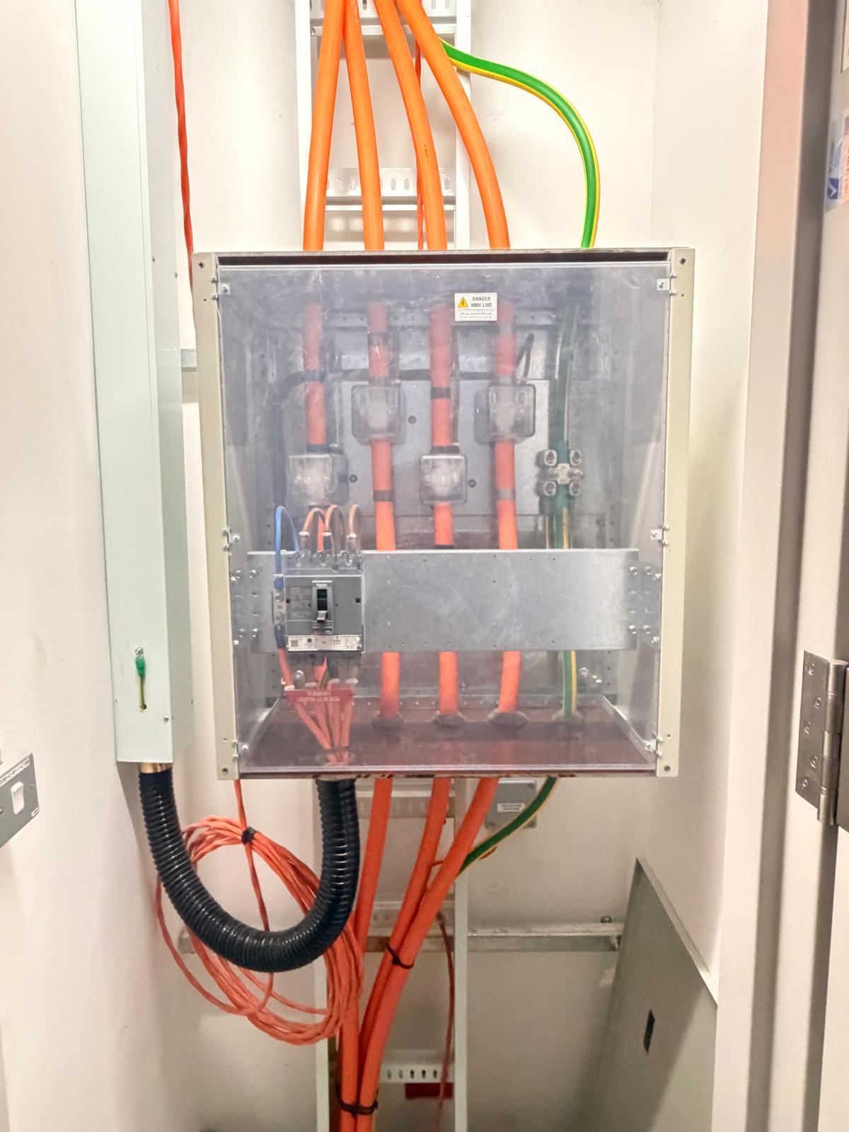 400V distribution board with MCCB and terminated single-core power cables — licensed electrical installation Singapore