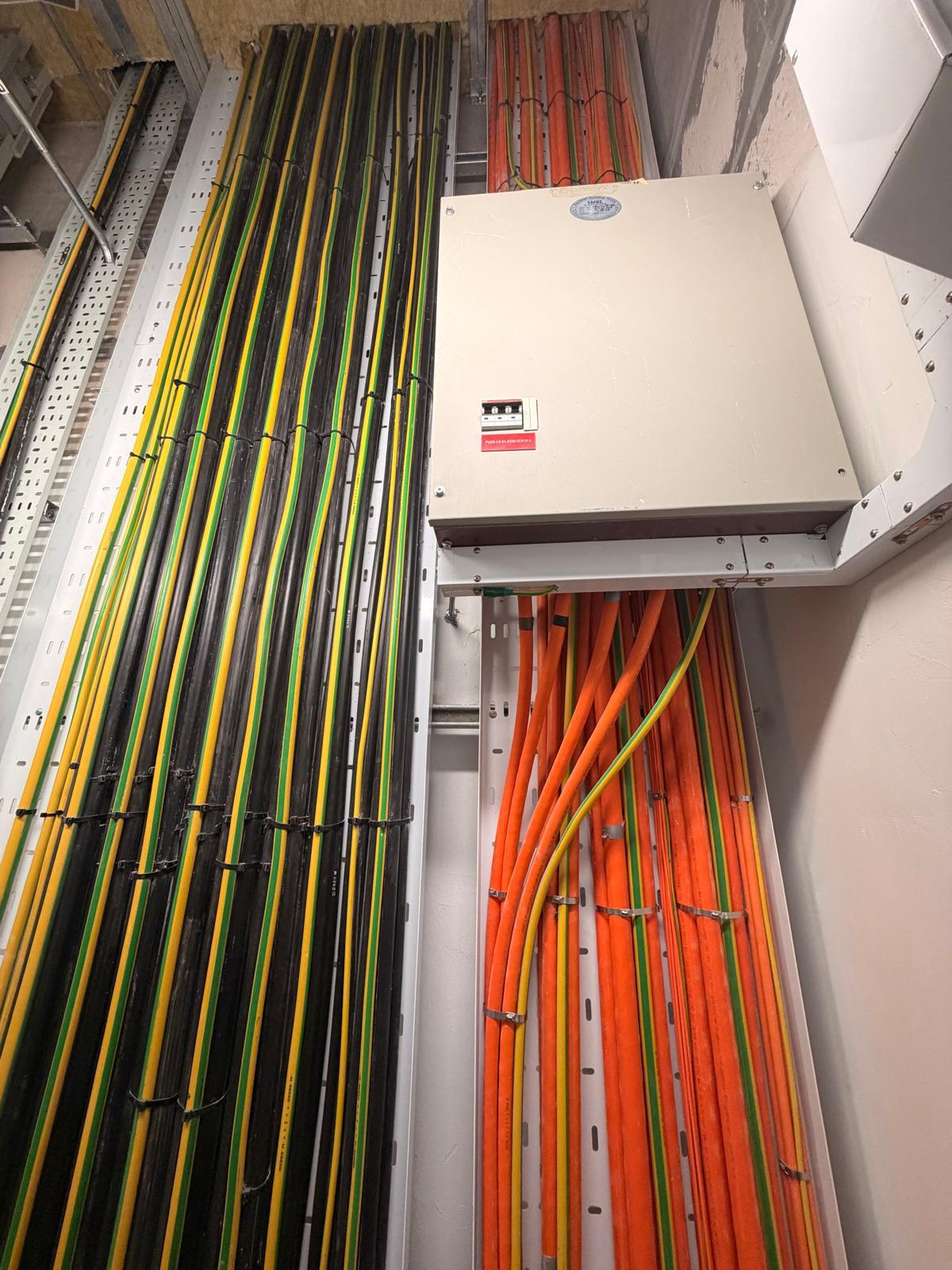 Structured power cable tray with LSZH and earthing cables routed to a distribution board — electrical work, Singapore